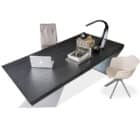 black wood modern desk with leather chairs and office decor